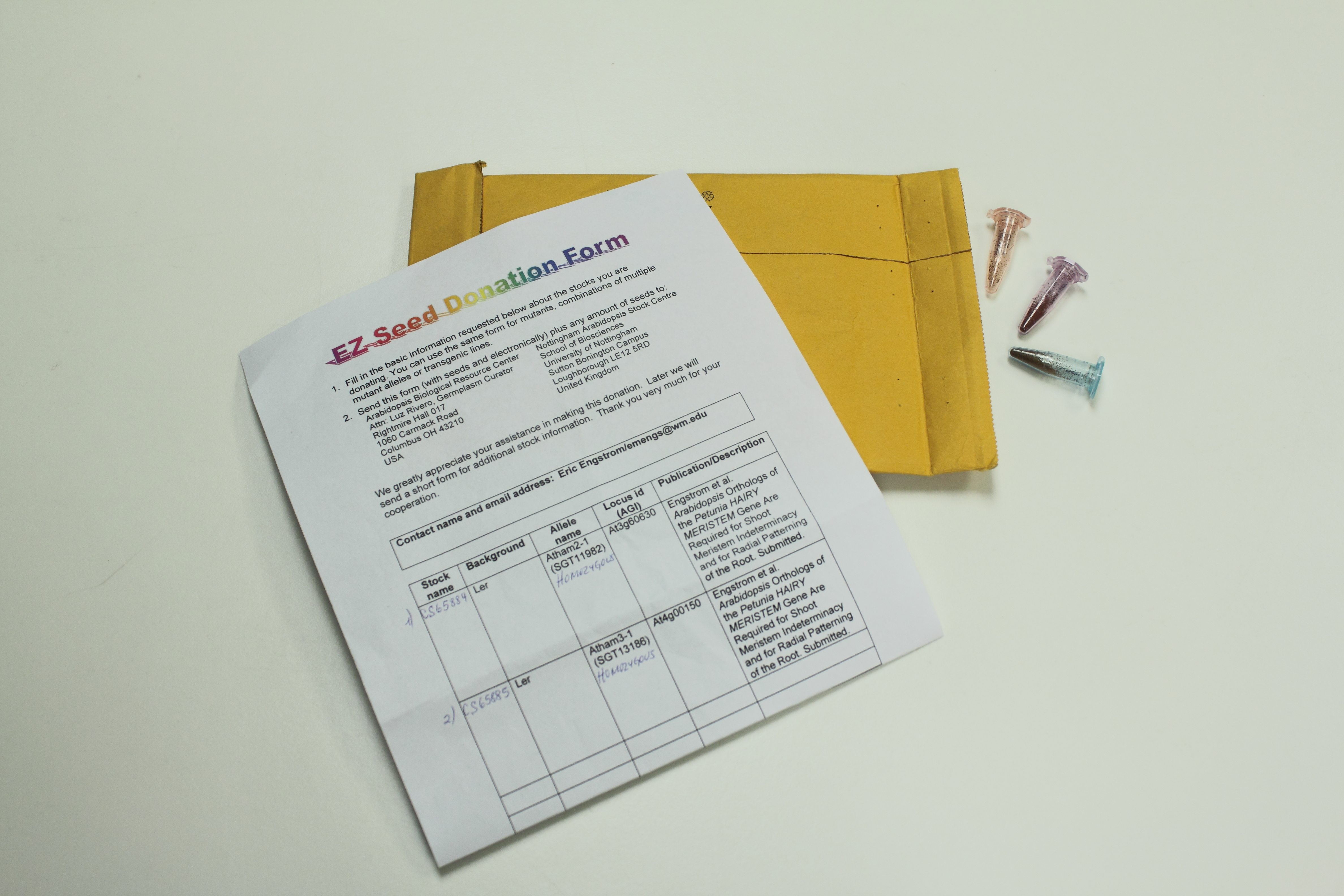 A package with donated seeds and a donation form